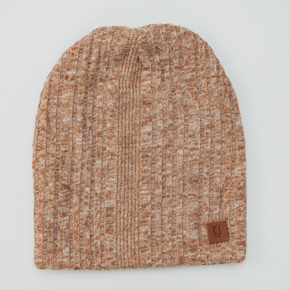 Knitted beanie with a brand label on a light gray background
