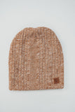 Knitted beanie with a brand label on a light gray background